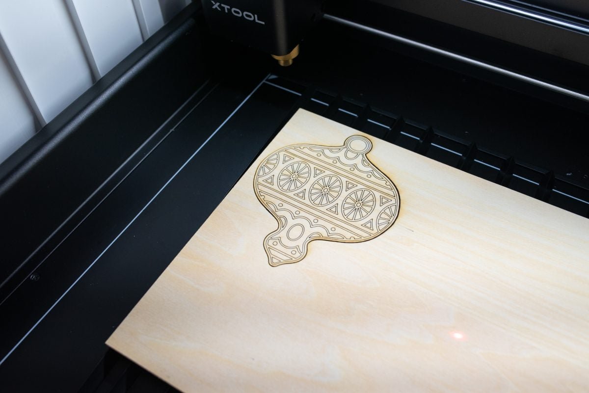 xtool-m1-review-3 Laser cut ornament still in the bed of the laser.